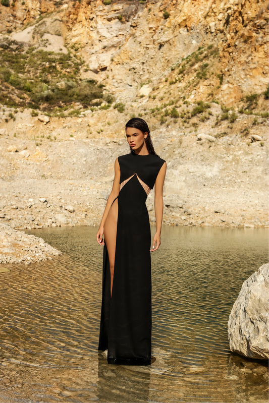 Black crepe dress with nude corset under open slit